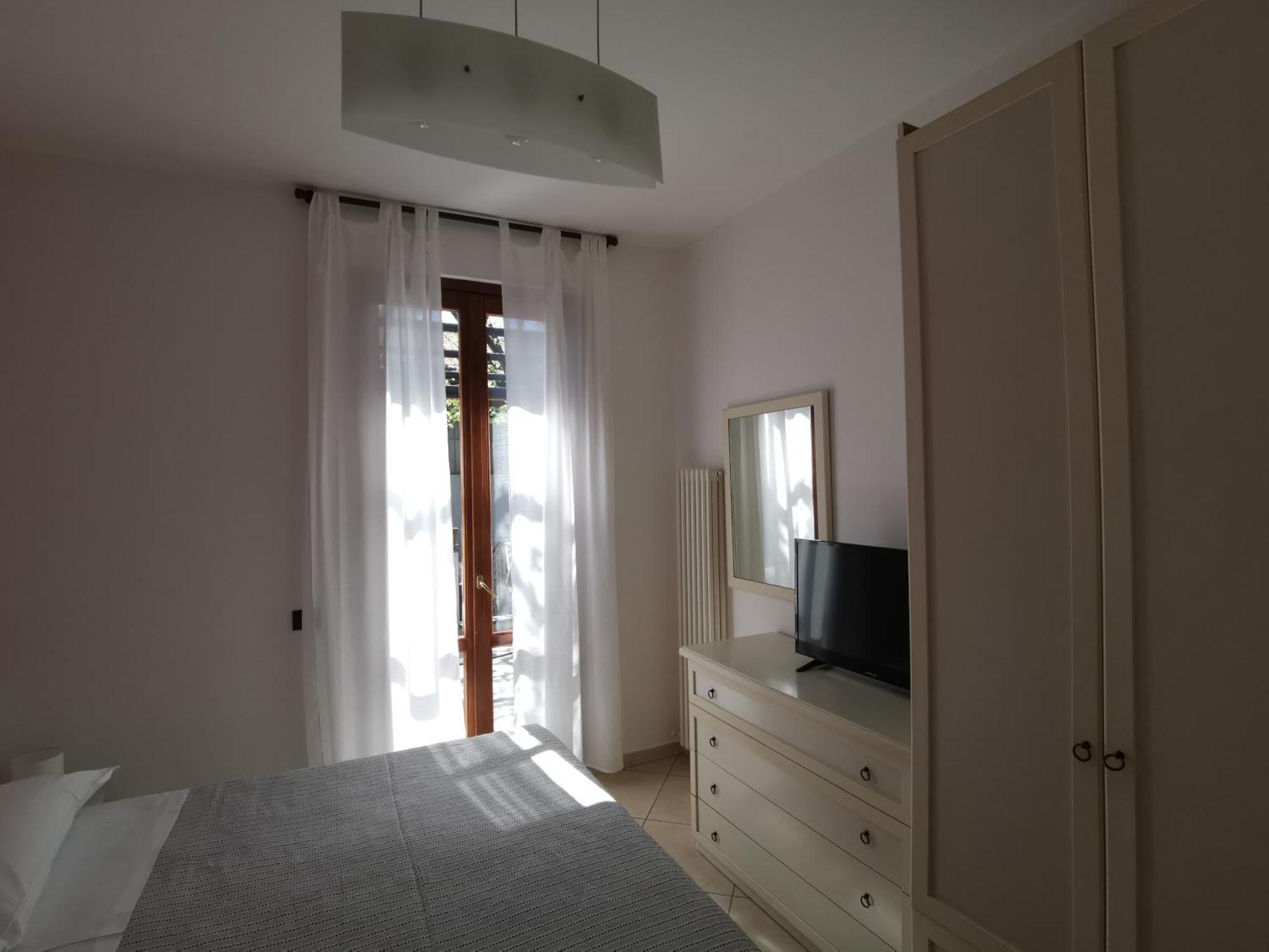 Bed and Breakfast Beb I Portici Черноббио Номер фото